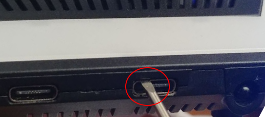 Step 1: Insert tool above Type-C port